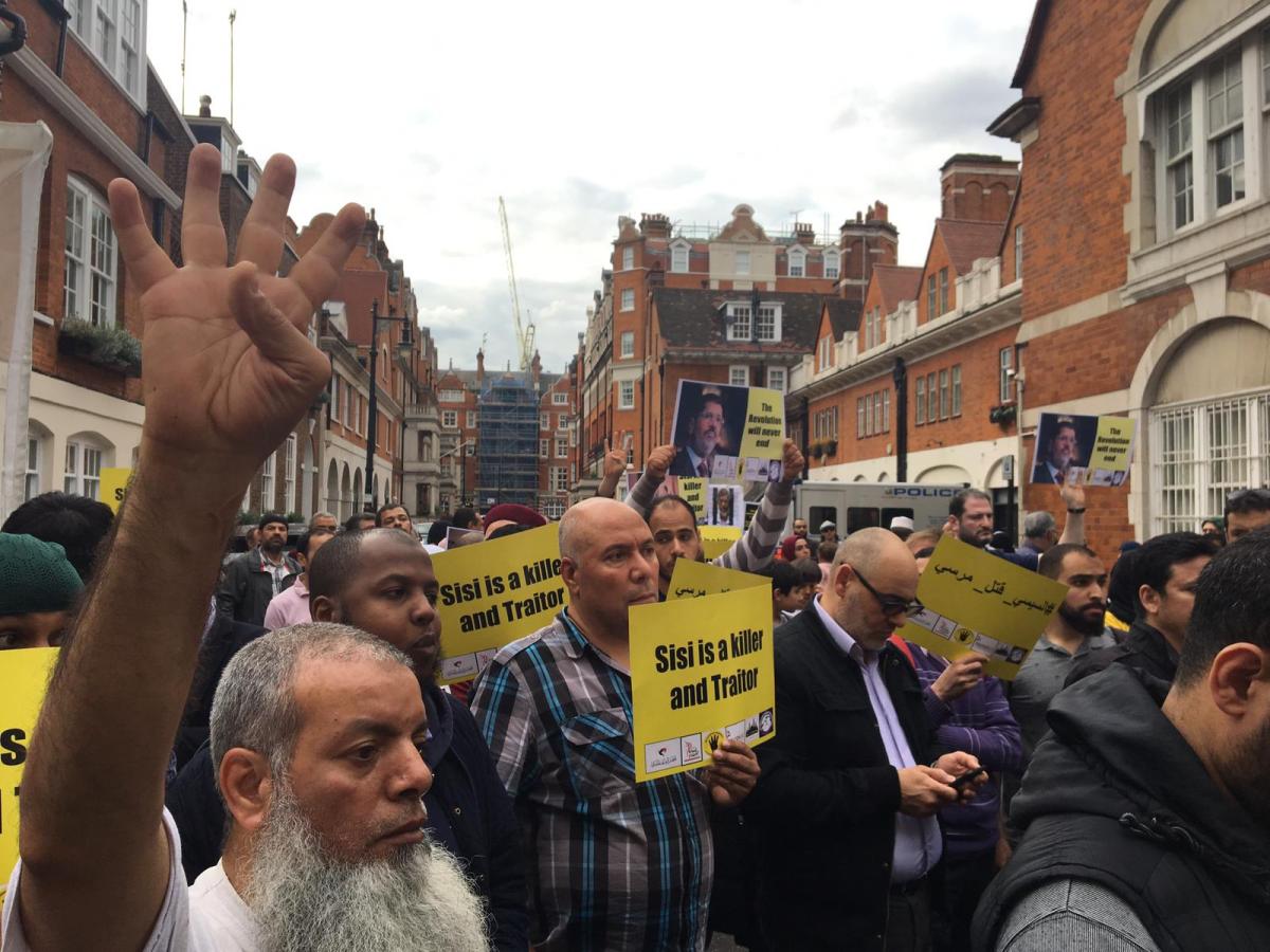 Protesters gather for a vigil at the Egyptian embassy, 21 June to protest the killing of Mohamed Morsi